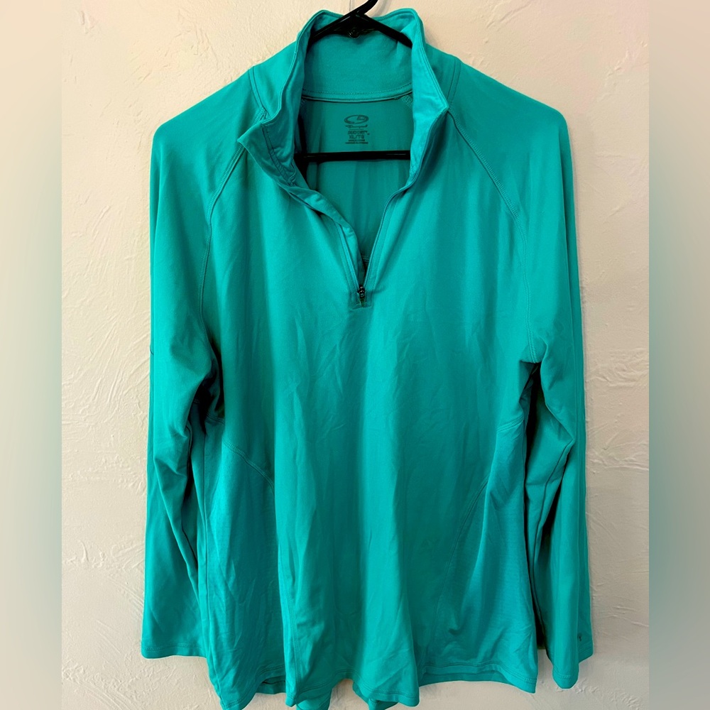 Teal green colored athleisure 3/4 zip fitness layer